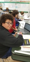 Mrs. Russell's 8th graders work on research paper. Mrs. Russell's room